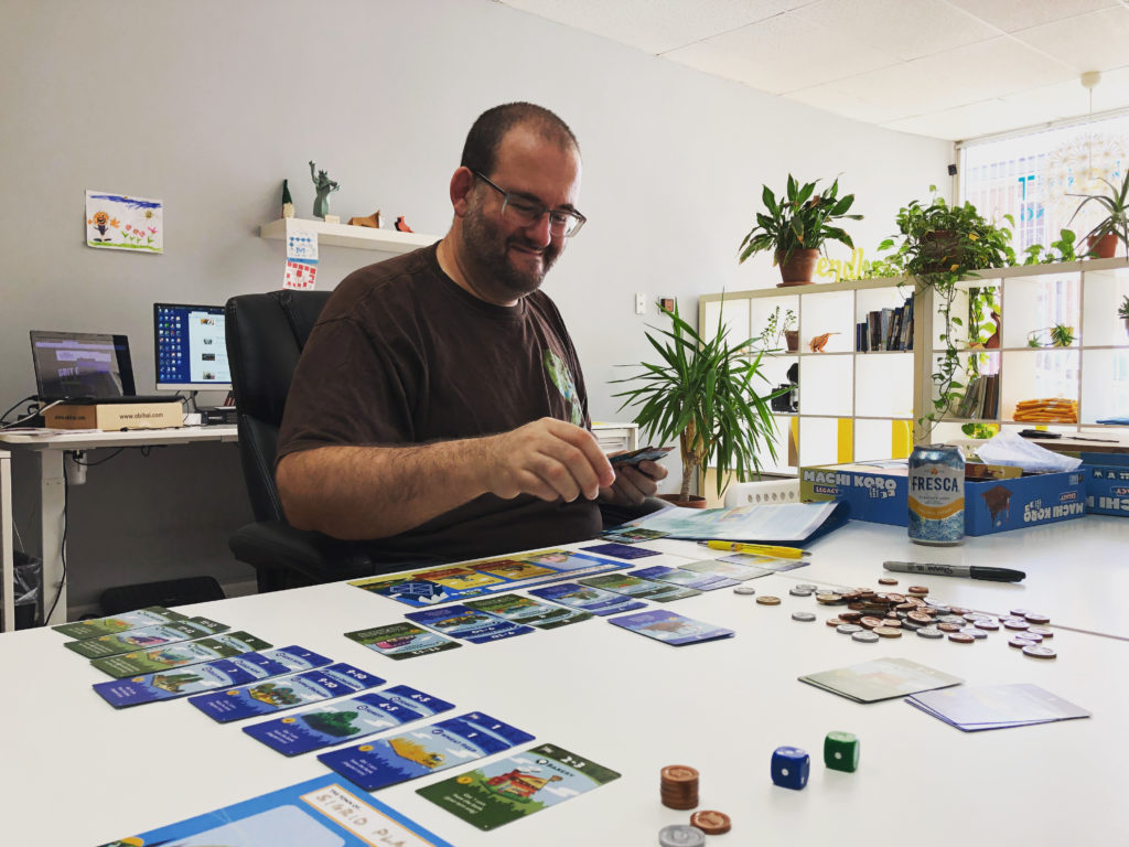 Web developer playing board game